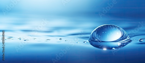 A droplet of water on a bac...
