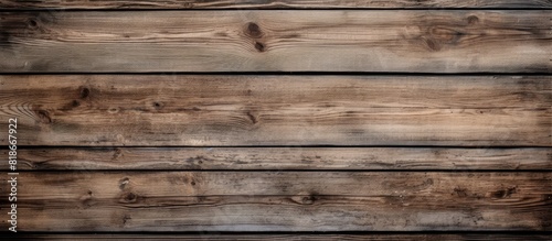 A close up copy space image of an old wooden board wall showcasing its textured surface in a vintage background