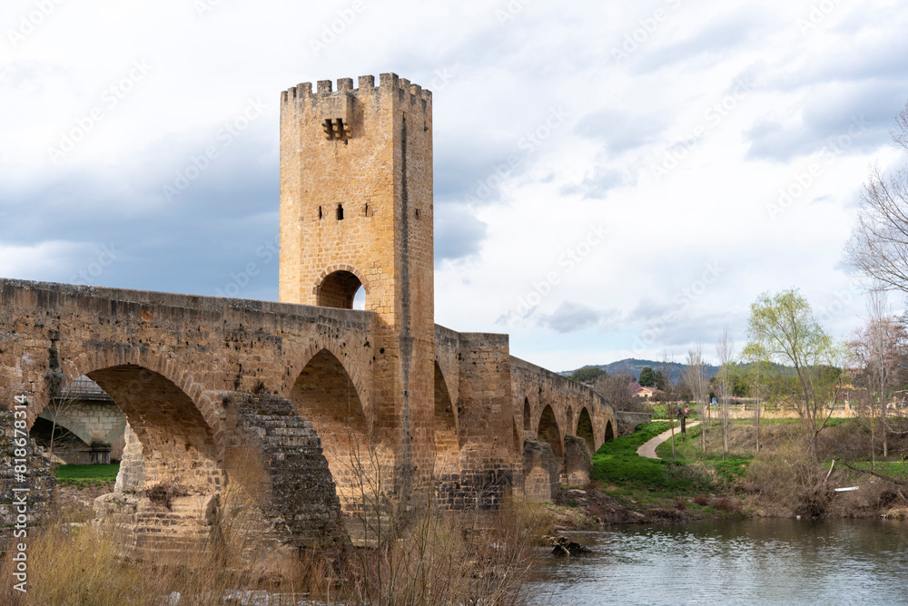 Detail shot of the impressive medieval stone bridge in the tourist town of Frías in the province of Burgos on a sunny day