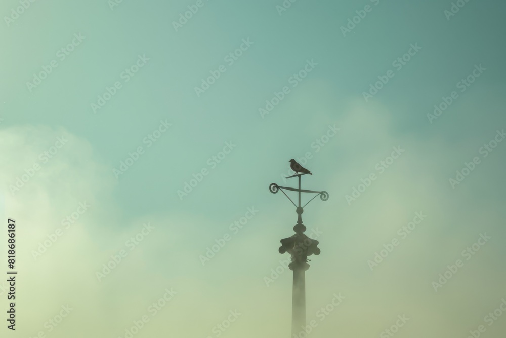 Weather Vane Atop a Roof Enveloped in Thick Smog at Dusk