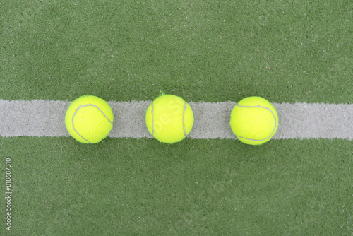 Tennis ball on green grass © Angelov