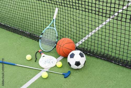 A group of sports equipment on background including tennis  basketball  and soccer on a background with copy space