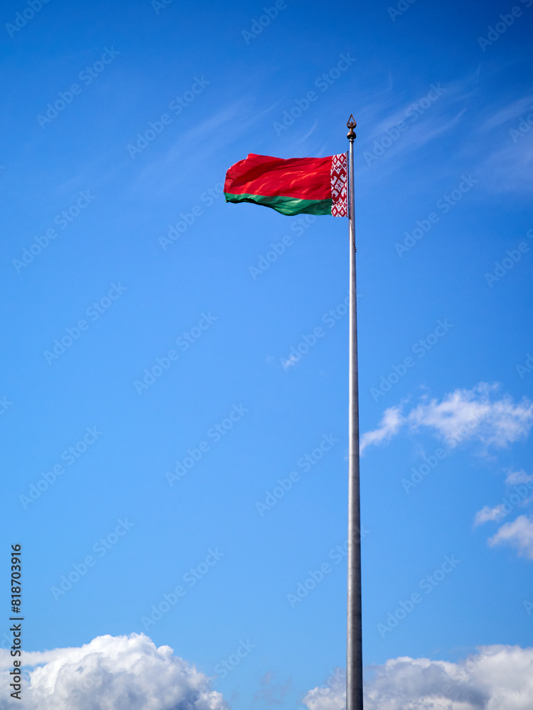 National flag of the Republic of Belarus against the blue sky National flag of the Republic of Belarus against the blue sky