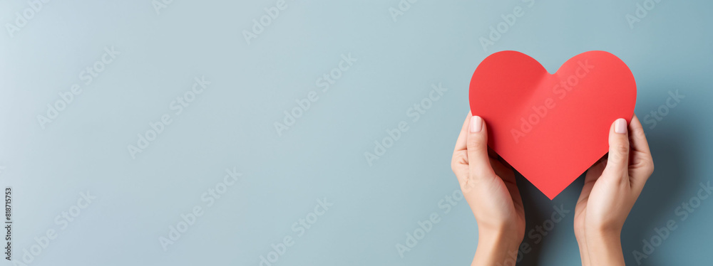 hand holding Red heart with clean copy space for Text, world heath day, healthy life style concepts, International cardiology day hand holding Red heart with clean copy space for Text, world heath day, healthy life style concepts, International cardiology day