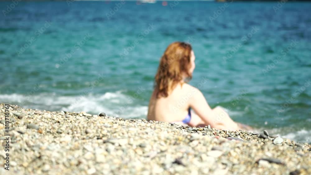 Woman swimming in calm sea at sunset, slow-motion, back view. Concept of body image and fitness, enjoying a serene beach. Happy woman with perfect fit body enjoys sea beach Woman swimming in calm sea at sunset, slow-motion, back view. Concept of body image and fitness, enjoying a serene beach. Happy woman with perfect fit body enjoys sea beach