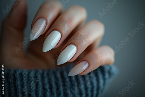 Beautiful woman s hand with well-groomed nails in a beige color  captured from the side in a closeup  with a bokeh background . Beautiful simple AI generated image in 4K  unique.