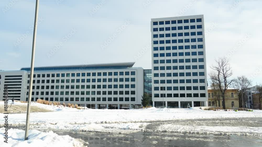Urban building in Unity Square (Vienybes aikste) on a sunny winter day in Kaunas, Lithuania