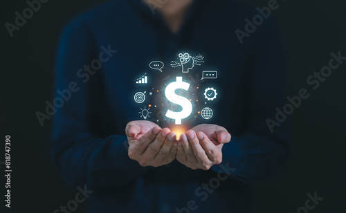 Businessman hand hold dollar currency sign for concept of AI (Artificial Intelligence) technology generative ideas for making money and financial investment in online market with Chatbot application