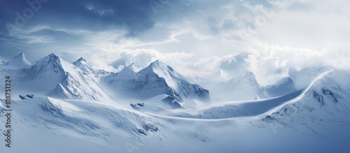 Snow covered mountains with falling snow Copy space image photo