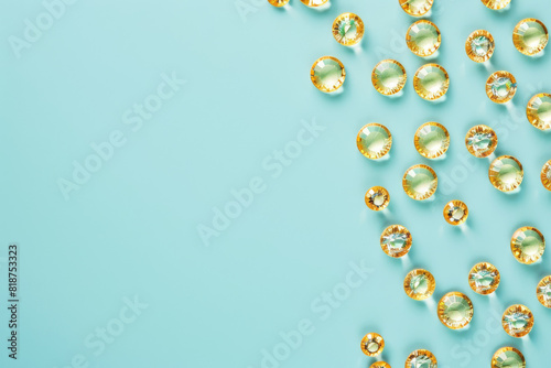 A blue background with a large number of yellow gems. The gems are arranged in a way that they look like they are floating on the blue background. Scene is one of luxury and opulence