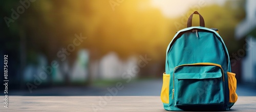 School bag with school supplies on a background Ample space available for adding text