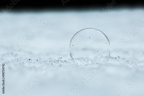 Bubbles in the snow developing the tiniest crystallisation as they start to freeze photo