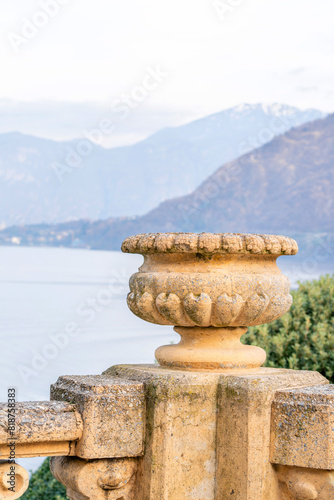 ornate stone urn with mountain backdrop