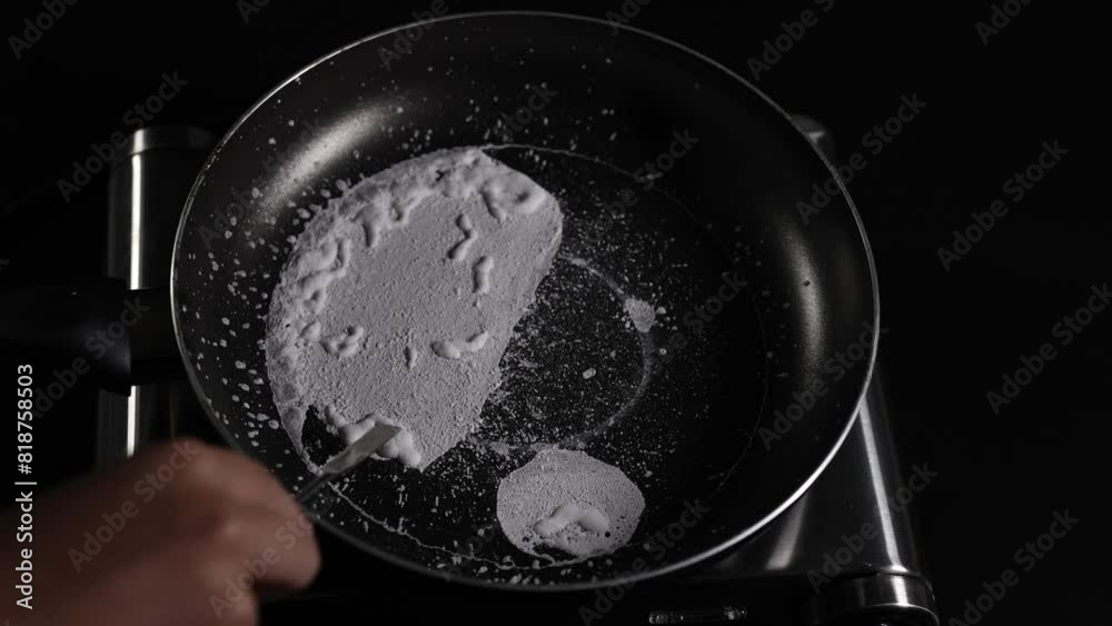 Scraping Salt from Pan Scraping Salt from Pan