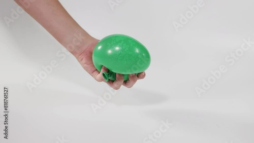 Squeezing Green Water Balloon