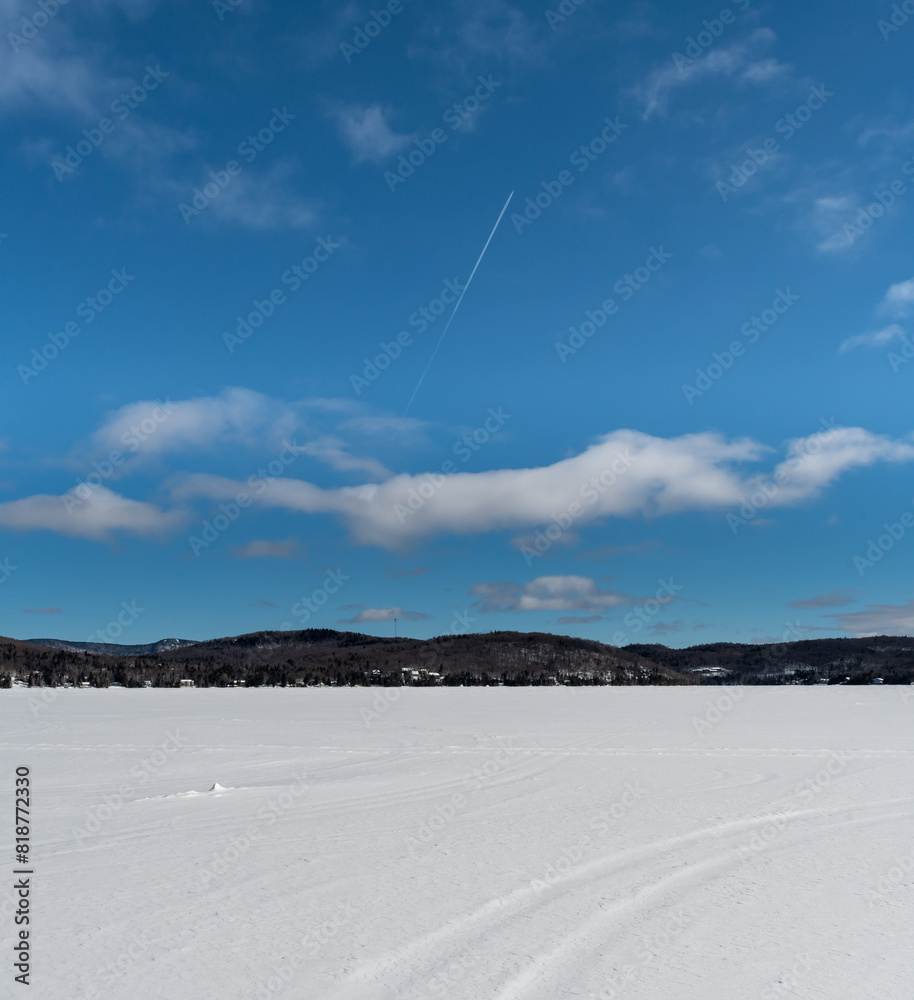 Hiking on a frozen lake in Quebec, Canada. Black Mountain Lake Hiking on a frozen lake in Quebec, Canada. Black Mountain Lake
