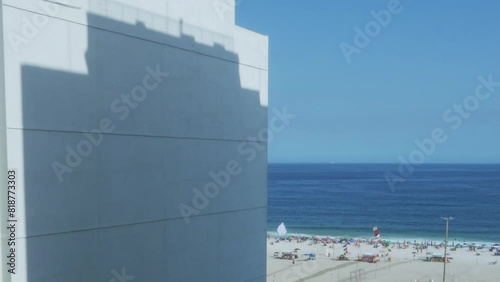 Timelapse of shadow from building moving on wall with Leme beach background in Rio de Janeiro, Brazi photo