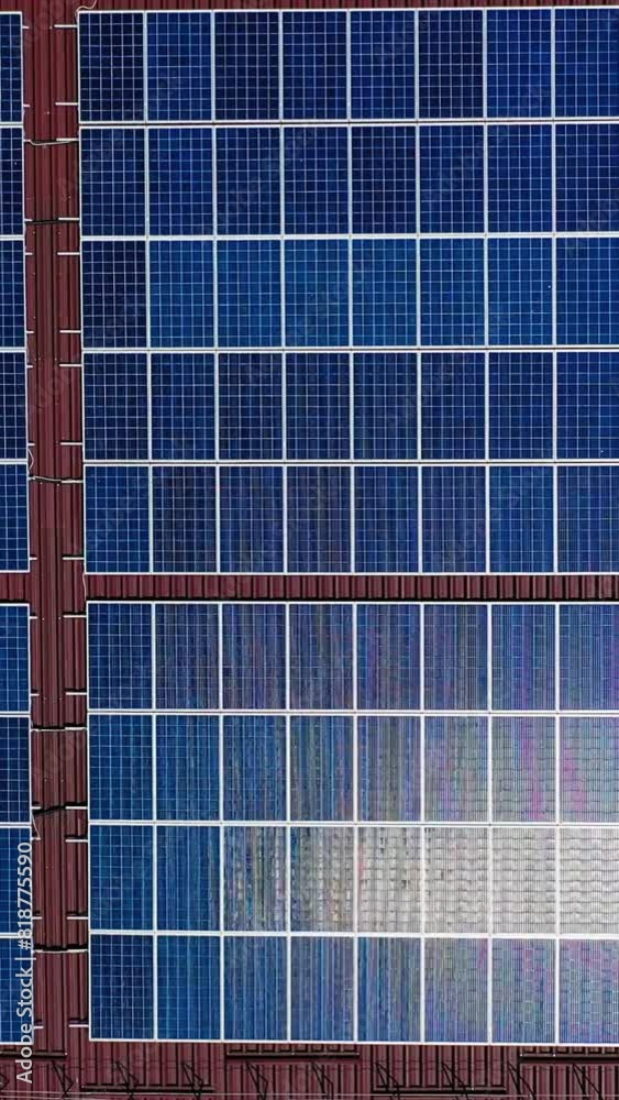 Solar panels from above. Aerial drone view of solar panels on the roof of building Vertical video Solar panels from above. Aerial drone view of solar panels on the roof of building Vertical video