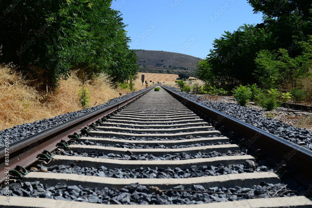 Closeup of the railway tracks running through the countryside Closeup of the railway tracks running through the countryside