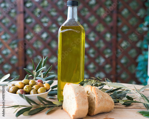 olive oil, extra virgin olive oil in a glass bottle, on a wooden table.