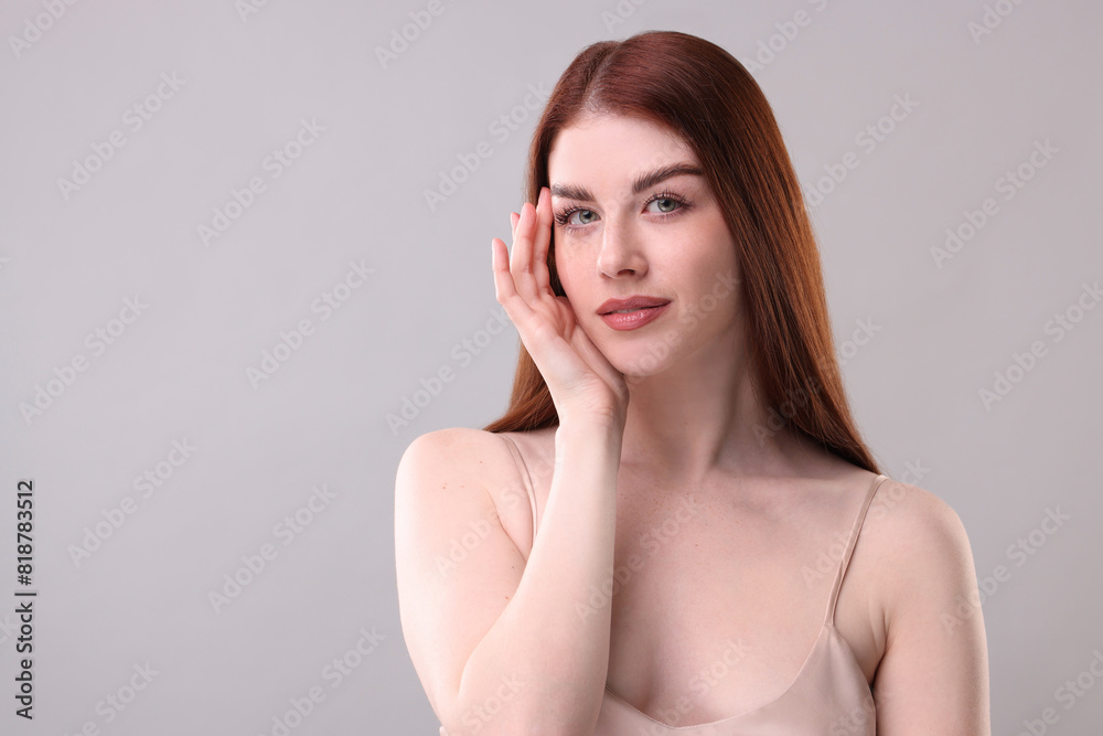Portrait of beautiful woman on grey background. Space for text Portrait of beautiful woman on grey background. Space for text