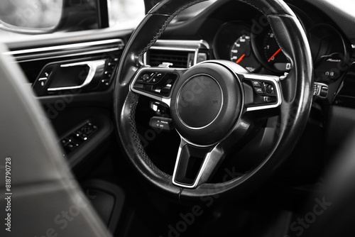 Steering wheel inside of modern black car, closeup © New Africa
