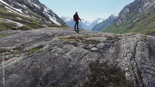 Person Standing on Top of Large Rock in Vestland County, Norway photo