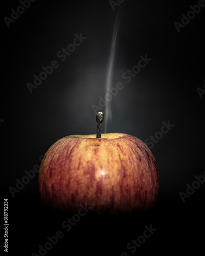 Mysterious, eerie plume of smoke rises from a diminutive apple photo
