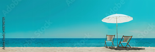 Beach umbrella with two chairs on the sand. summer travel vacation background with copy space. 