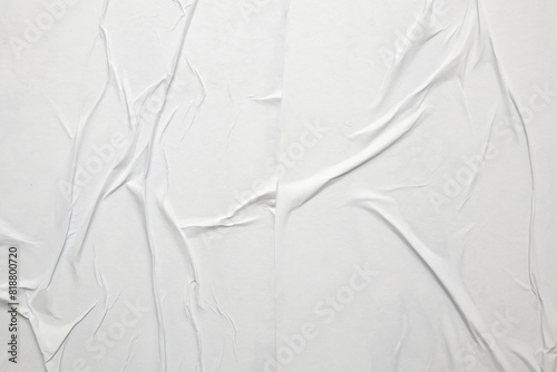 white crumpled and creased glued wrinkled paper poster texture background photo