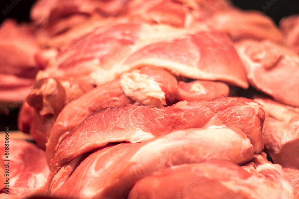 Animal product, raw meat, pork or beef, sits on the table Animal product, raw meat, pork or beef, sits on the table