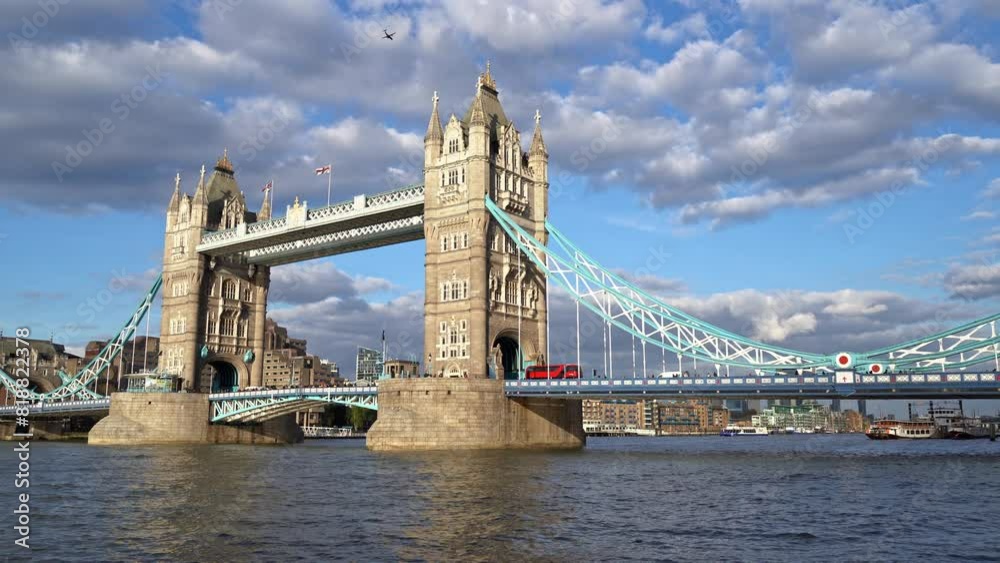 London Tower Bridge with red bus and airplane