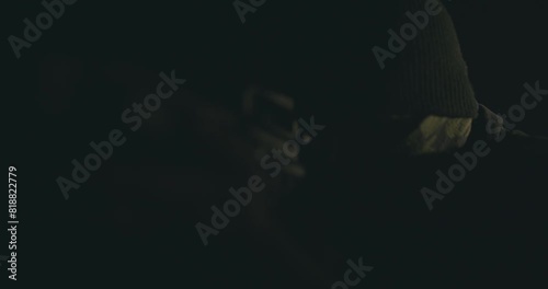 Masked gunman wielding a rifle