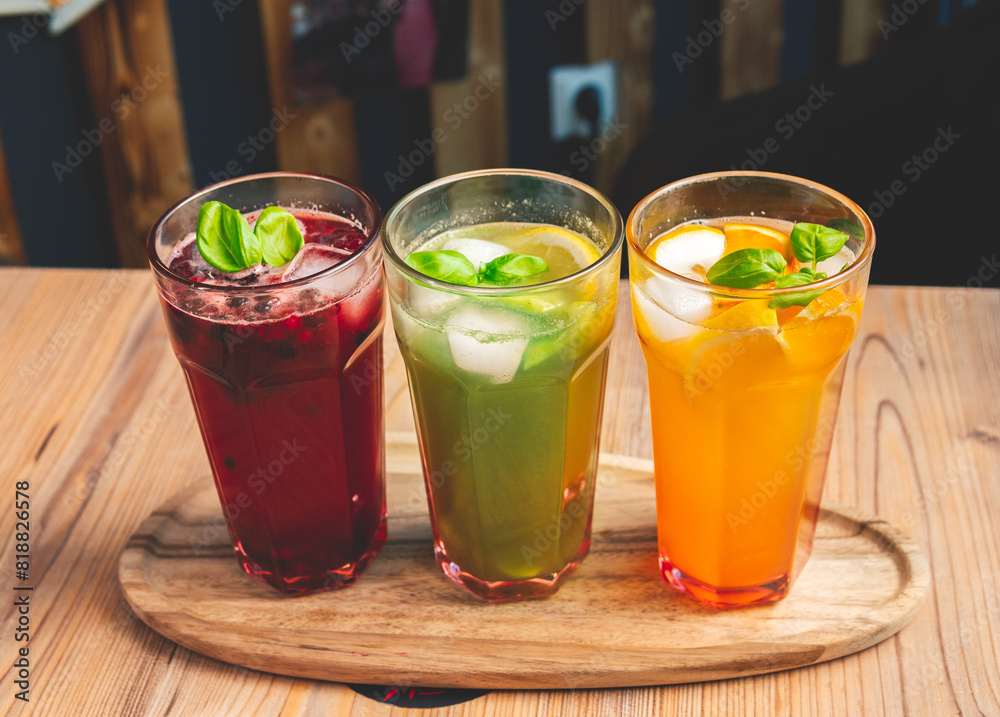 different flavored lemonades, raspberry, kiwi, orange different flavored lemonades, raspberry, kiwi, orange