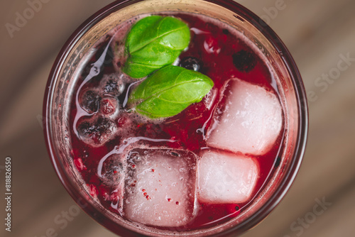 fresh raspberry lemonade with mint leaves, ice and currant pieces