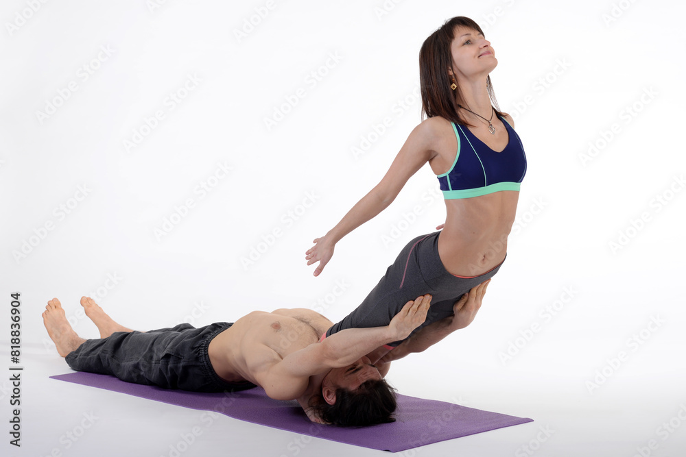 People practicing acro yoga in photo studio. Acro yoga sport theme concept. People practicing acro yoga in photo studio. Acro yoga sport theme concept.