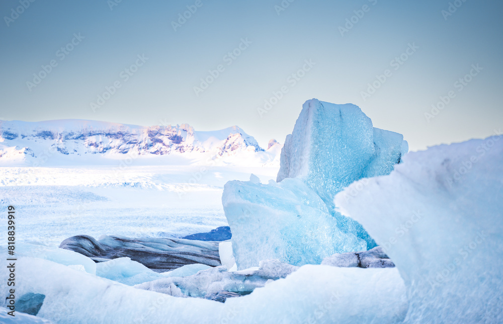 The ground is covered with ice with blue snow flakes The ground is covered with ice with blue snow flakes