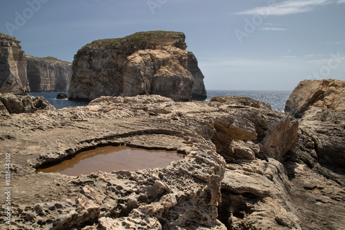 Beautiful shot of stunning rocky landscape surrounding Dwejra Bay, Malta photo