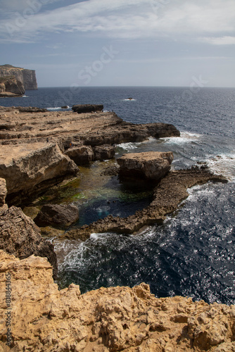 Beautiful shot of stunning rocky landscape surrounding Dwejra Bay, Malta photo