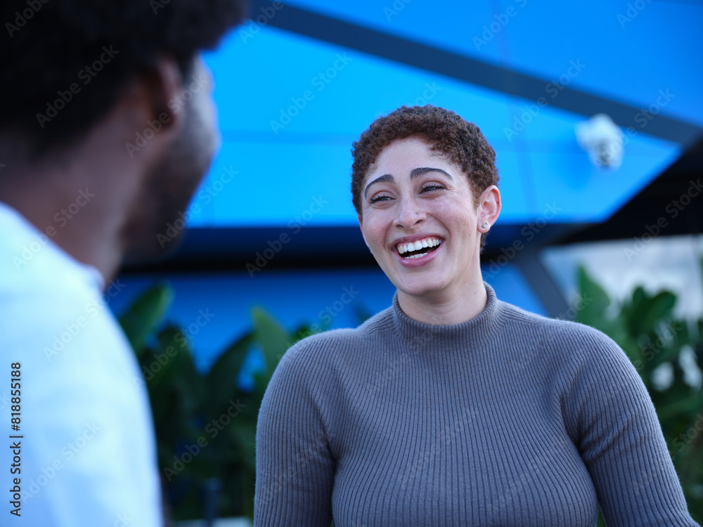 Man and woman having a conversation outside Man and woman having a conversation outside