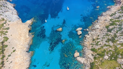 Aerial drone top-down photo of sailboats and yachts in Cala Figuera Beach, Mallorca, Spain