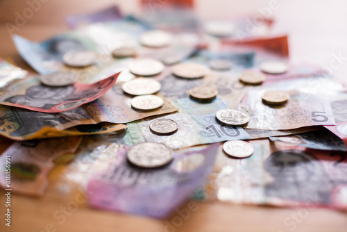 pile of Australian money spread out on a table photo