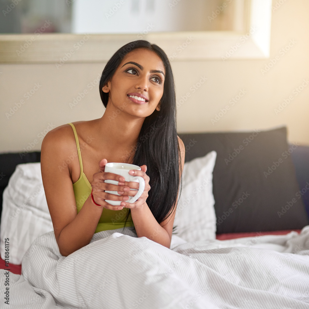 Indian woman, home and smile in bed with coffee for wake up in morning and memories. Female person, bedroom and relaxing or thinking with ideas or thoughts and for comfort, wellness or wellbeing Indian woman, home and smile in bed with coffee for wake up in morning and memories. Female person, bedroom and relaxing or thinking with ideas or thoughts and for comfort, wellness or wellbeing