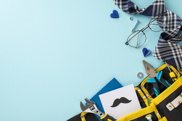 A creative Father's day setup with various tools in a yellow bag, stylish tie, glasses, and heart shapes on a soft blue background