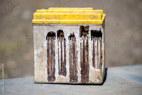 Small plastic electrolytic battery with iron terminals for a motorcycle