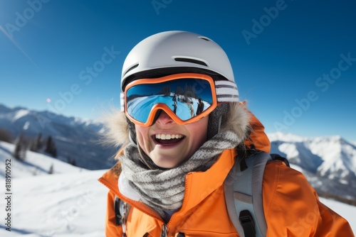 a happy woman wearing a helmet and ski goggles skiing on a clear winter day. 