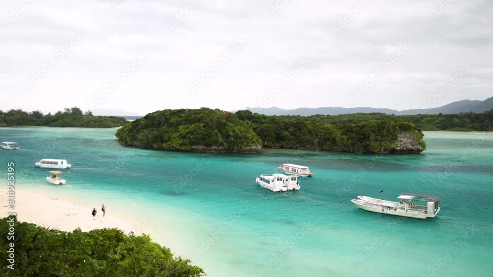 Kabira Bay in Ishigaki island, Okinawa Prefecture, Japan. White sand beach with Turquoise clean water and small green islands. High quality 4k footage. Kabira Bay in Ishigaki island, Okinawa Prefecture, Japan. White sand beach with Turquoise clean water and small green islands. High quality 4k footage.