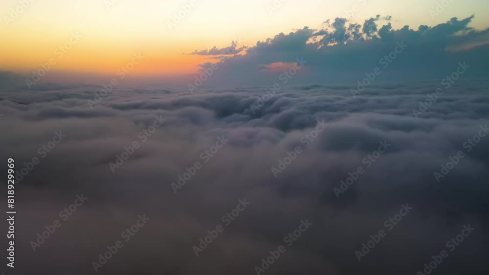 Flying over the clouds with the late sun. Sunrise or sunset colorful sky background. Flying over the clouds with the late sun. Sunrise or sunset colorful sky background.