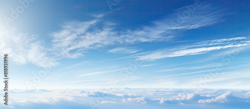 Panoramic format image showcasing the blue sky adorned with contrails leaving traces across the vast expanse Copy space image photo