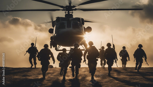 silhouette of soldiers descending from a helicopter with a rope 